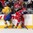 TORONTO, CANADA - JANUARY 4: Russia's Alexander Sharov #23 reaches for the puck while Sweden's Jens Looke #24 looks on during semifinal action at the 2015 IIHF World Junior Championship. (Photo by Andre Ringuette/HHOF-IIHF Images)